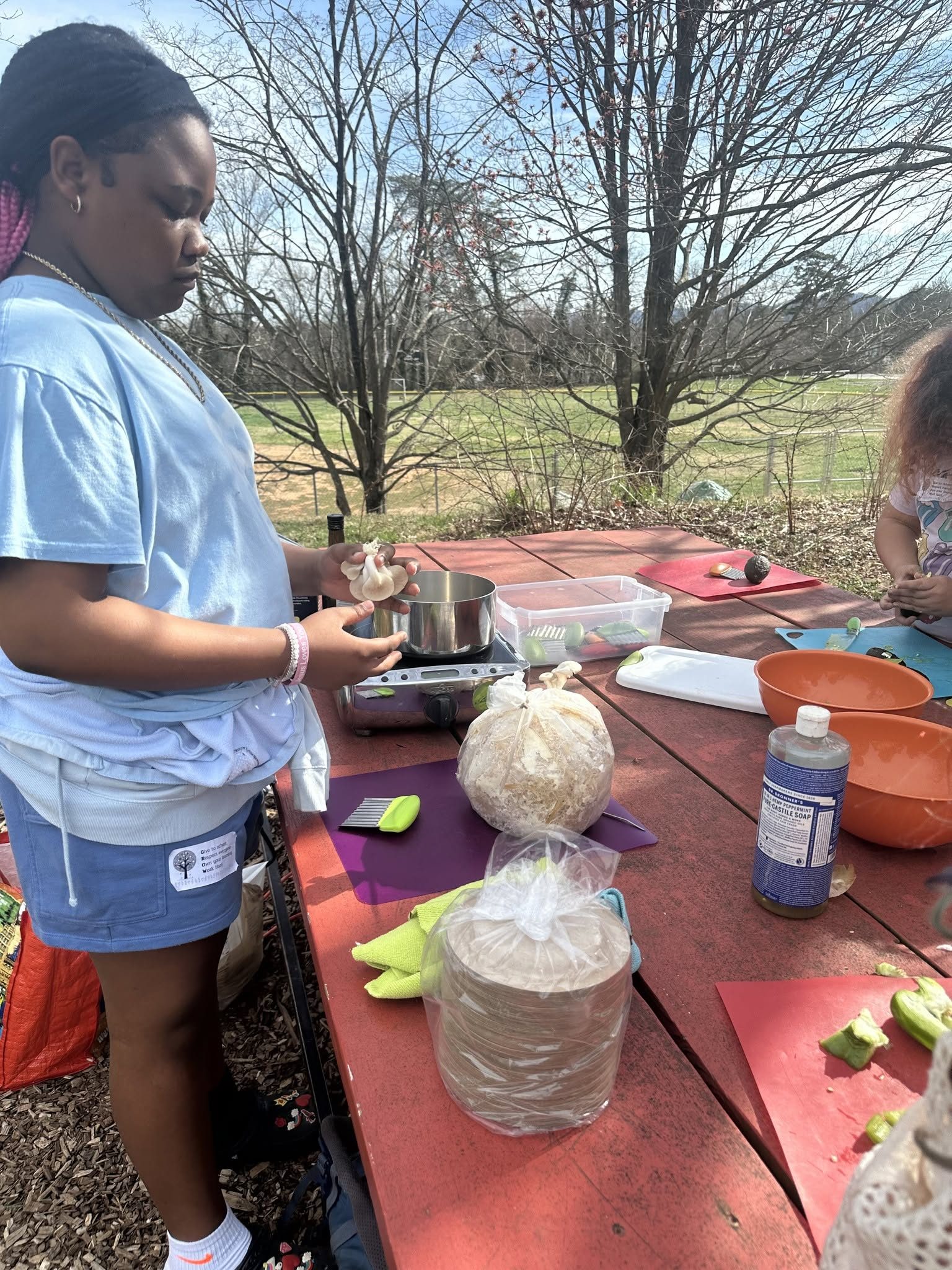 A student at a tincture workshop on the farm
